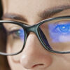 A-close-up-shot-of-a-womans-eyes-wearing-blue-light-glasses-that-reflect-a-blue-computer-screen-2-1024x672 1.56 Blue Cut SHMC Green Prescription Lenses – Screen & UV Protection